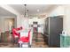Spacious kitchen with a large island and stainless appliances open to the living room area at 1828 Wellspring Ct, Graham, NC 27253