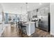 Bright, open kitchen with an island, stainless steel appliances, and a seamless transition to the inviting living area at 1928 Fishamble # 24, Fuquay Varina, NC 27526
