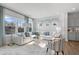 Inviting living room with large windows, plush seating, and chic decor, creating a perfect space for relaxation at 1928 Fishamble # 24, Fuquay Varina, NC 27526