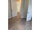 View of bedroom featuring doors and wood-look flooring at 2001 Ballston Pl, Knightdale, NC 27545