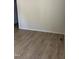 Empty bedroom featuring wood-look flooring and neutral-colored walls at 2001 Ballston Pl, Knightdale, NC 27545