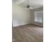 Inviting bedroom with light-colored walls, wood-look flooring, and a bright window at 2001 Ballston Pl, Knightdale, NC 27545