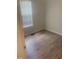 Bedroom featuring bright natural light, wood-look flooring, and neutral colored walls at 2001 Ballston Pl, Knightdale, NC 27545