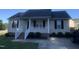 Charming single-story home with a welcoming front porch and well-maintained landscaping at 2001 Ballston Pl, Knightdale, NC 27545
