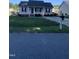 Quaint one-story home featuring a cozy front porch and a tidy front yard with a mailbox at 2001 Ballston Pl, Knightdale, NC 27545