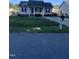 Quaint one-story home featuring a cozy front porch and a tidy front yard with a mailbox at 2001 Ballston Pl, Knightdale, NC 27545