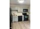 Modern kitchen featuring gray cabinets, stainless steel appliances, and stylish backsplash at 2001 Ballston Pl, Knightdale, NC 27545