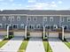 New construction townhomes featuring private decks and integrated garages at 2006 Nola Ln, Durham, NC 27713