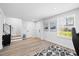 Finished basement showcasing hardwood floors, minimalist design, and natural light from a window at 2006 Nola Ln, Durham, NC 27713