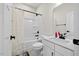 Bathroom featuring white vanity, tiled shower with curtain, and modern fixtures at 2006 Nola Ln, Durham, NC 27713