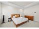 Bright bedroom featuring a wooden bed frame, soft carpet, and matching dresser at 2006 Nola Ln, Durham, NC 27713