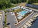 Aerial view of a community pool area and playground offers ample parking at 2006 Nola Ln, Durham, NC 27713