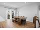 Bright dining room with wood table, bench seating, and sliding glass doors to the deck at 2006 Nola Ln, Durham, NC 27713