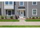 Charming entryway shows a white front door and meticulously maintained landscaping at 2006 Nola Ln, Durham, NC 27713