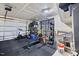 Garage gym featuring workout equipment, weights, and rubber mat flooring at 2006 Nola Ln, Durham, NC 27713