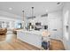 Bright, open kitchen boasts a large island, stainless steel appliances, and seamless flow to living spaces at 2006 Nola Ln, Durham, NC 27713