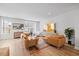 Bright living room with modern furniture, large windows, and hardwood floors at 2006 Nola Ln, Durham, NC 27713