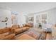 Bright and airy living room featuring a comfortable seating area and large windows at 2006 Nola Ln, Durham, NC 27713