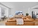 Comfortable living room with leather furniture, a large TV, and plenty of natural light at 2006 Nola Ln, Durham, NC 27713