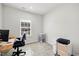 Well-lit office space with modern desk setup, ample natural light, and neutral decor at 2006 Nola Ln, Durham, NC 27713