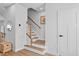 Clean, modern staircase with wood railings and white risers, connecting different levels of the home at 2006 Nola Ln, Durham, NC 27713