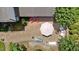 Aerial view of outdoor living space, highlighting stone patio, seating, and landscaped yard at 2127 Somers Ave, Burlington, NC 27215