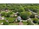 Aerial view of neighborhood, highlighting home's location, landscaping, and surrounding trees at 2127 Somers Ave, Burlington, NC 27215