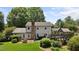 Expansive backyard with lush landscaping, a deck, and well-maintained lawn at 2127 Somers Ave, Burlington, NC 27215