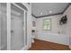 Bright bathroom featuring a separate glass-enclosed shower and a tub with tile surround at 2127 Somers Ave, Burlington, NC 27215