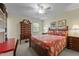 Well-lit bedroom offering a bed with floral bedding, and classic furniture at 2127 Somers Ave, Burlington, NC 27215