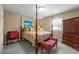 Comfortable bedroom showcasing a four-poster bed, bench, and ample closet space at 2127 Somers Ave, Burlington, NC 27215