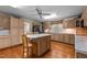 Spacious kitchen with wood cabinets, marble countertops, and a center island at 2127 Somers Ave, Burlington, NC 27215