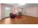 Cozy living room with hardwood floors, natural light, and comfortable seating arrangements at 2127 Somers Ave, Burlington, NC 27215