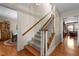 Classic staircase with wood and carpet, leading to the upper level of the home at 2127 Somers Ave, Burlington, NC 27215