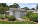 Exterior view of backyard storage shed with access ramp and mature landscaping at 2127 Somers Ave, Burlington, NC 27215