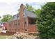 A home featuring detailed brickwork, mature trees, and a private backyard at 2210 Hope St, Raleigh, NC 27607