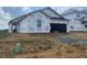 New construction home with Tyvek wrap, showcasing the initial phase of the building process at 223 Norman Ave, Lillington, NC 27546