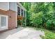 Brick patio with a view of a screened in porch at 225 Midenhall Way, Cary, NC 27513