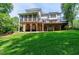 A spacious backyard with a lawn and deck at 225 Midenhall Way, Cary, NC 27513