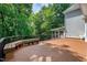 Spacious backyard deck with built-in benches overlooking lush greenery at 225 Midenhall Way, Cary, NC 27513