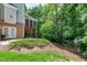 View of backyard featuring lawn, brick exterior, and screened porch at 225 Midenhall Way, Cary, NC 27513
