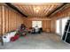 Spacious unfinished basement with exposed beams, a window, double doors, and a concrete floor at 225 Midenhall Way, Cary, NC 27513