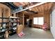 Unfinished basement with open ceiling and visible utilities, and for sale sign by window at 225 Midenhall Way, Cary, NC 27513