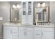 Bright bathroom with double sinks, marble countertop, and cabinet at 225 Midenhall Way, Cary, NC 27513