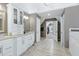 Spacious bathroom with double sinks, granite countertop, and walk-in closet at 225 Midenhall Way, Cary, NC 27513