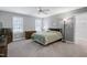 Comfortable bedroom with a ceiling fan and carpet at 225 Midenhall Way, Cary, NC 27513