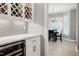 Elegant butler pantry with wine storage, gray subway tile, and quartz countertops at 225 Midenhall Way, Cary, NC 27513