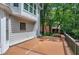 Spacious outdoor deck with a wooden bench overlooking lush greenery at 225 Midenhall Way, Cary, NC 27513