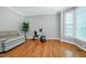 Well-lit exercise room featuring hardwood floors and large windows offering plenty of sunlight at 225 Midenhall Way, Cary, NC 27513