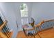 Bright foyer features hardwood stairs, chandelier, and large arched window above the front door at 225 Midenhall Way, Cary, NC 27513